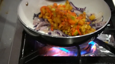 The Chef Of The Restaurant Prepares Fried Vegetables In The Pan In The Kitchen Stock Footage 105881092