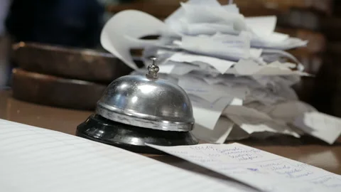 Chef ringing the bell and calls a waiter in restaurant Stock Footage 108829896