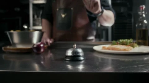 Chef rings the tabletop bell when a dish Stock Footage 314755599
