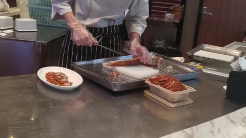 The chef at the roast duck restaurant is cutting the duck meat Stock Footage 170593496