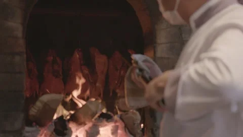 Chef Roasting Ducks Over Open Fire in Traditional Beijing Restaurant Kitchen Stock Footage 345854159