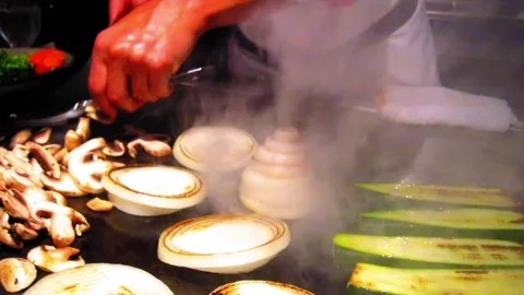 Chef Roasting Vegetables On Flat Griddle In Kitchen At Restaurant - Los Angeles, Stock Footage 237132311