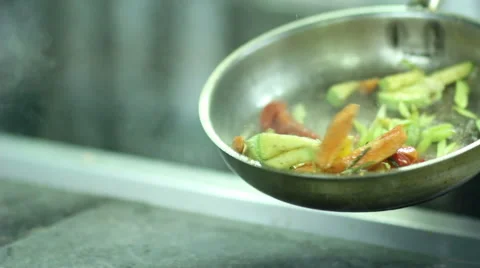 Chef roasting vegetables on the pan Video stock 61851081