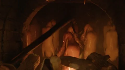 Chef Roasting Whole Birds Over Open Fire in Traditional Brick Oven, Beijing Stock Footage 345787285