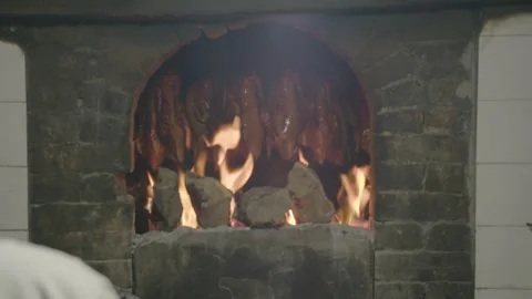 Chef Roasting Whole Poultry Over Open Flames in Traditional Beijing Restaurant Stock Footage 345773546