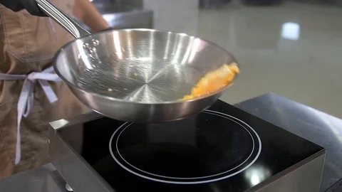 Chef roasts chopped pumpkin Stock Footage 97880861