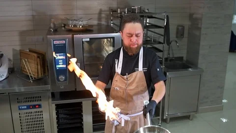 Chef roasts chopped pumpkin Stock Footage 97880886