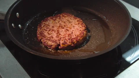 The chef roasts a cutlet for a burger Stock Footage 158021608