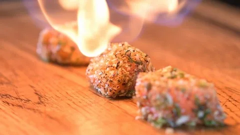 Chef roasts the fish burner Stock Footage 97881126