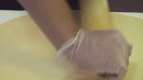Chef roll the dough into a thin sheet Video stock 84678996