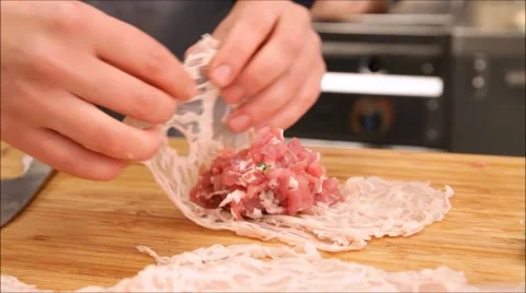 A chef rolling a crepinette Video stock 67354883