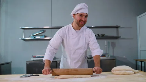 Chef Rolling Dough with Focus in Kitchen Stock Footage 299658216