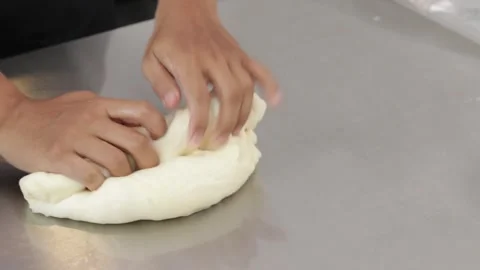 Chef rolling out white bread dough Stock Footage 296045539