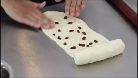Chef rolling out white bread dough Stock Footage 296045803