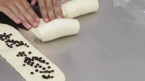 Chef rolling out white bread dough Stock Footage 296045863
