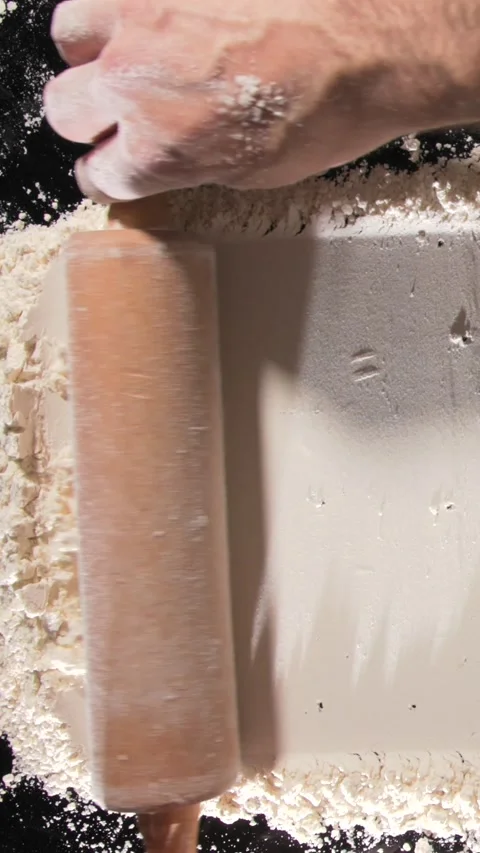 Chef rolling pin over flour baking process close up kitchen Stock Footage 332234934