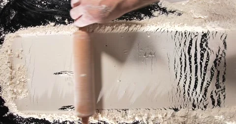 Chef rolling pin over flour baking process close up kitchen Stock Footage 332234966
