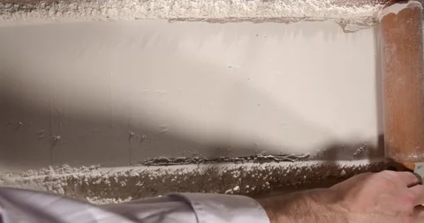 Chef rolling pin over flour baking process close up kitchen Stock Footage 332235167