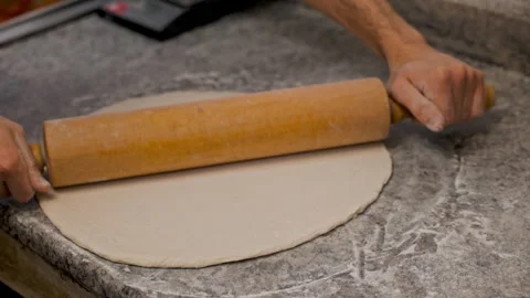 Chef Rolling Pizza Dough – Shaping Crust for Perfect Pizza 動画素材 303200021
