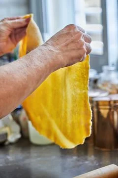 Chef rolls out the dough for making chard pie. Step by step recipe Stock Photos