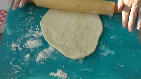 The chef rolls out the dough for the pie Stock Footage 183419897