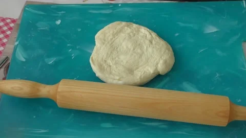 The chef rolls out the dough for the pie Stock Footage 183420717