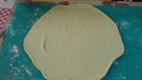 The chef rolls out the dough for the pie Stock Footage 183420771