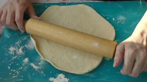 The chef rolls out the dough for the pie Stock Footage 183421280