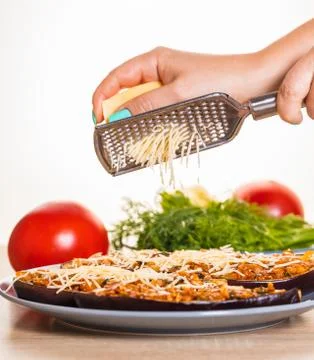 Chef is rubbing cheese Stock Photos