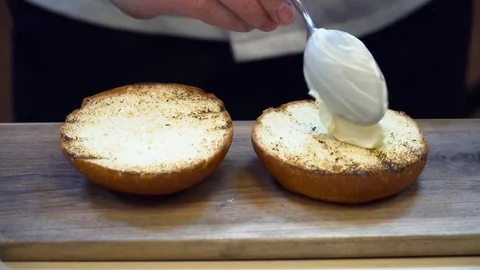 Chef rubing the sauce in the bread Stock Footage 77042307