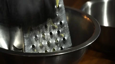 Chef rubs courgette on a cut for a dish Stock Footage 148314329