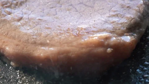 Chef salt grilled meat at stone cutting board. Closeup man hands salting steak Video stock 115777470
