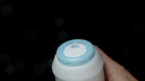 The chef salts the dish from a plastic salt shaker, and tiny salt particles slow Video stock 255222131
