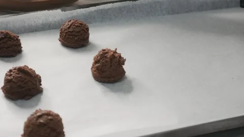 Chef Scooping Chocolate Cookie Dough onto Baking Tray Stock Footage 327949553