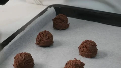 Chef Scooping Chocolate Cookie Dough onto Baking Tray Stock Footage 327949565