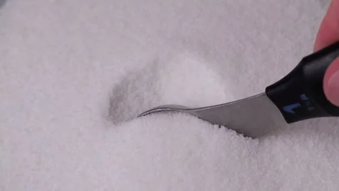 Chef scooping fine white sugar in slow motion Stock Footage 306414852