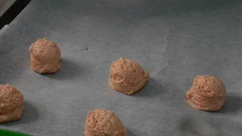 Chef Scooping Strawberry Cookie Dough onto Baking Tray Stock Footage 329905732