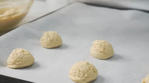 Chef Scooping Vanilla Cookie Dough onto Baking Tray Stock Footage 328206358