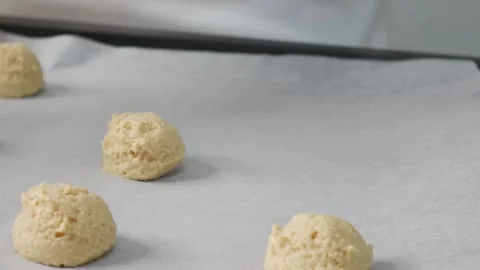 Chef Scooping Vanilla Cookie Dough onto Baking Tray Stock Footage 329905709