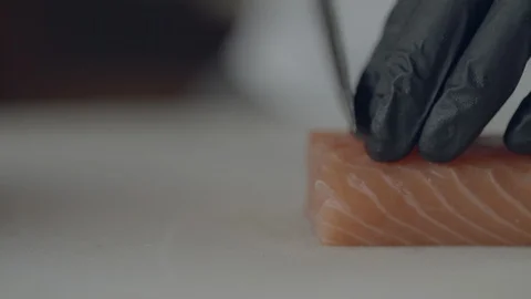 Chef At A Seafood Restaurant Is Preparing Salmon Sashimi And Serving It On Ice Video stock 113403048