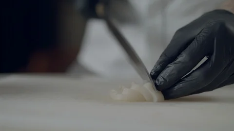 Chef At A Seafood Restaurant Is Preparing Scallop Sashimi And Serving It On Ice Video stock 113403284