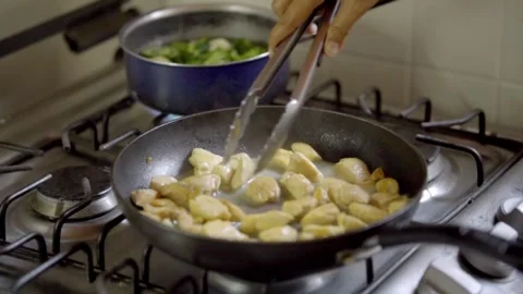 Chef Searing Diced Chicken Breasts In Frying Pan With Tongs 스톡 동영상 333864752
