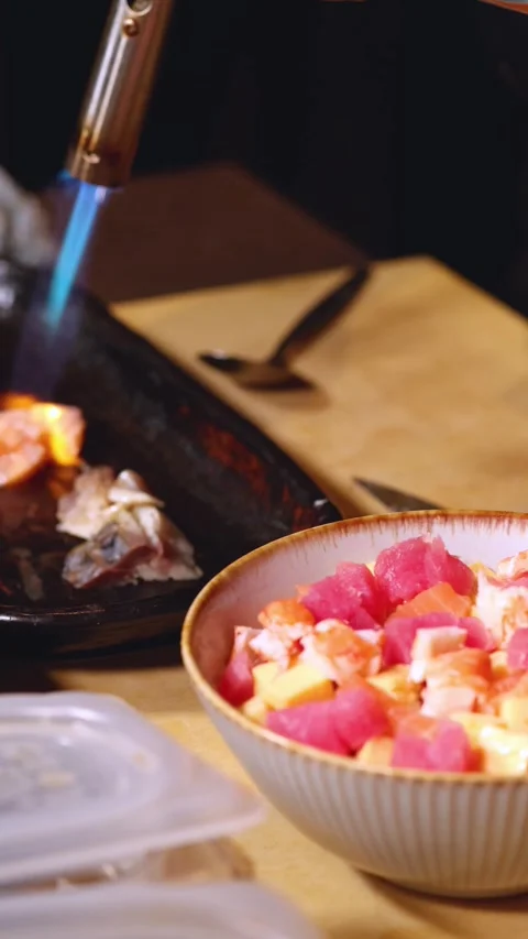 Chef Searing Fresh Fish with Kitchen Blowtorch Stock Footage 327115660