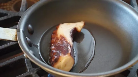 Chef Searing Fresh Octopus Tentacle in Pan for Authentic Italian Seafood Pizza Stock Footage 337677532