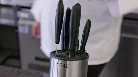 Chef selecting a knife in a professional kitchen 스톡 동영상 231770231