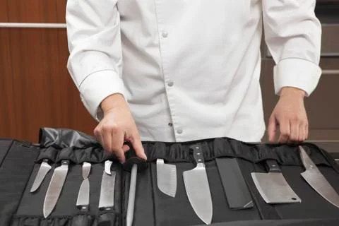 Chef Selecting Knife Sharpener Out Of Full Set Stock-Fotos