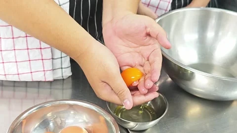 Chef separating egg yolk from white by hand. Stock Footage 339200374
