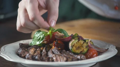 Chef serve basil dish grill steak from beef meat fillet mignon in restaurant. Stock Footage 124713036