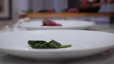 Chef servers meat on a plate Stock Footage 87756618