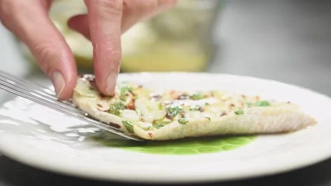 Chef serves a baked fish fillet on a plate. Stock Footage 161015186